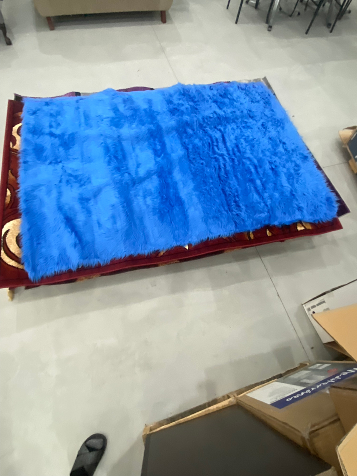Blankets, throws or rugs on a pallet